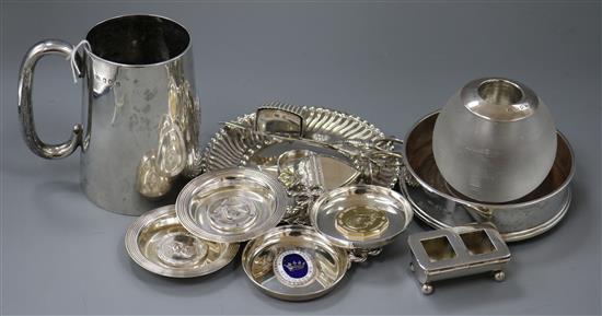 An Edwardian silver mug, silver stamp box, silver coaster, silver stand and other plated and white metal items.